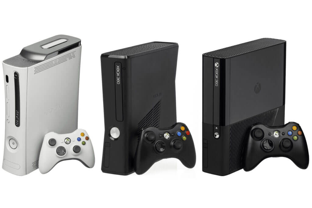 Three Xbox 360 consoles with controllers.