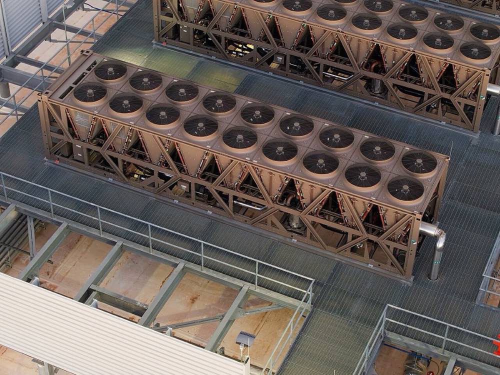 Air-cooled heat rejection units and walkways on the roof of a data center