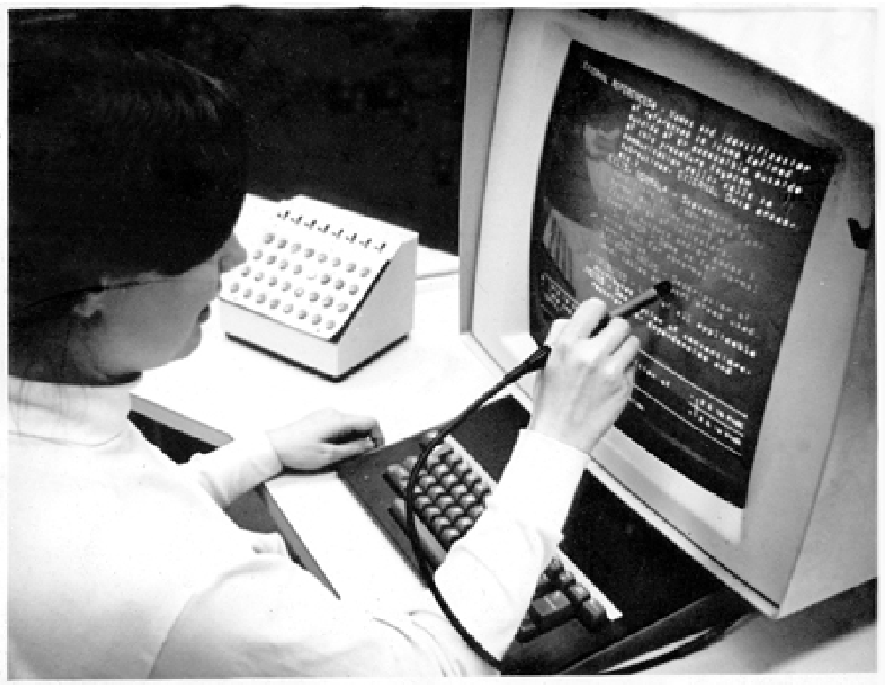 A person using the “Hypertext Editing System” (HES).
