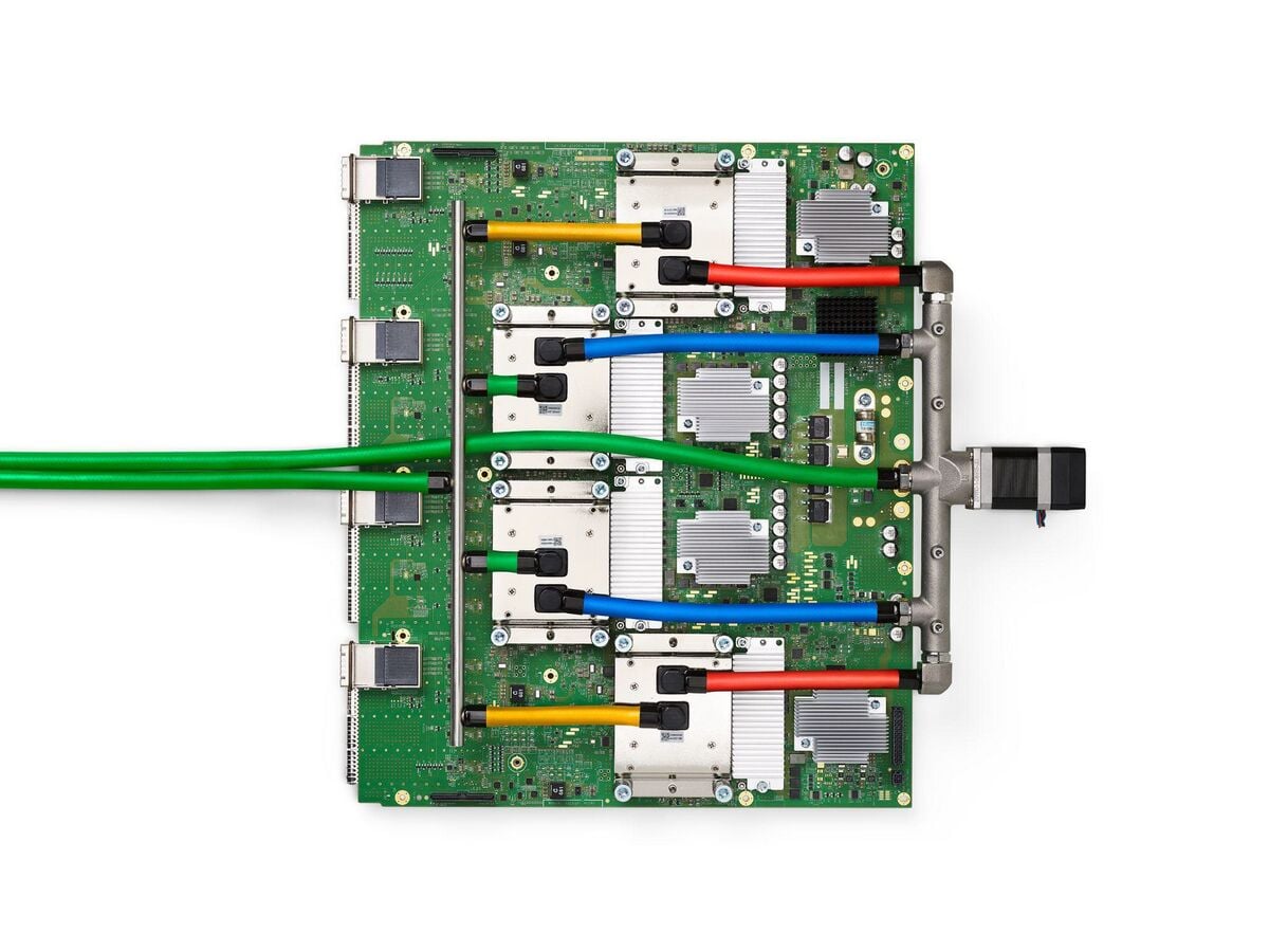 Google TPU v4 board with four liquid-cooled TPU packages, Google's own inference and training chip