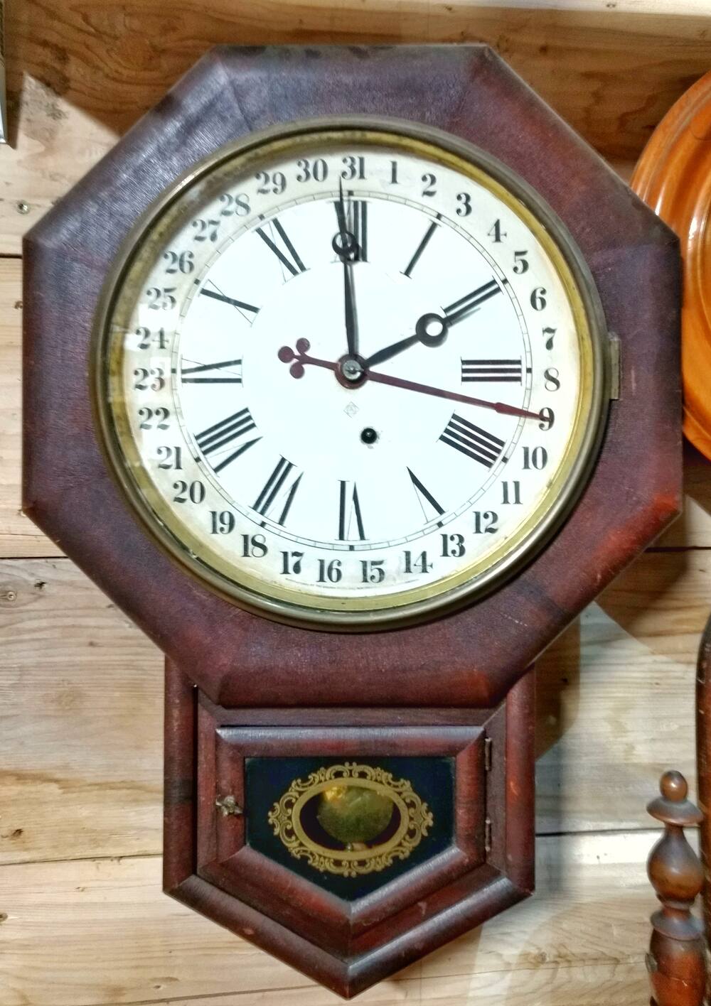 Grandfather clock with a calendar date dial beside the time face