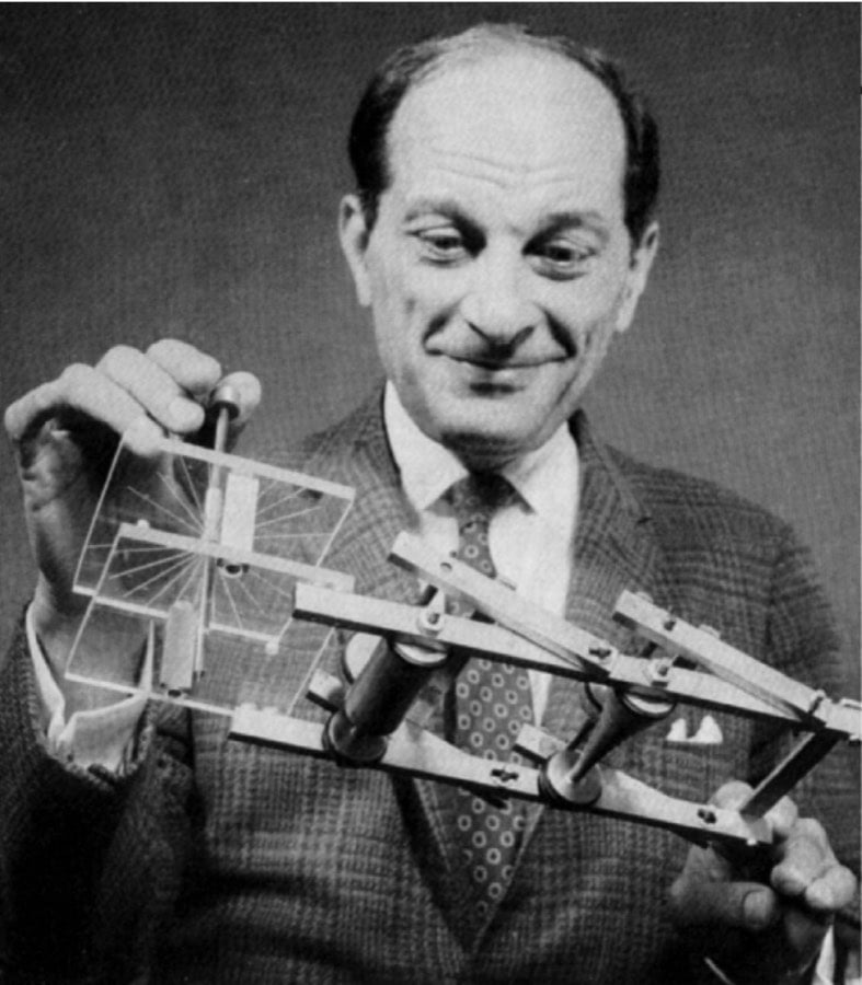 Stanislaw Ulam holding the FERMIAC, an analog device for tracing neutron paths