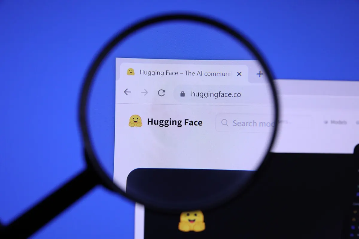 The Hugging Face website seen through a magnifying glass, the model hub where most open-weight LLMs from LLaMA to Kimi K3 are published