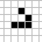 A glider in Conway's Game of Life moving diagonally across the grid, one cell every four generations